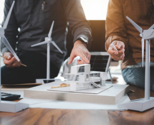 Two engineer design professionals discussion about calculate to use pure energy nature and Installing solar panels on roof house to generate electricity working with model, and Solar panel sample